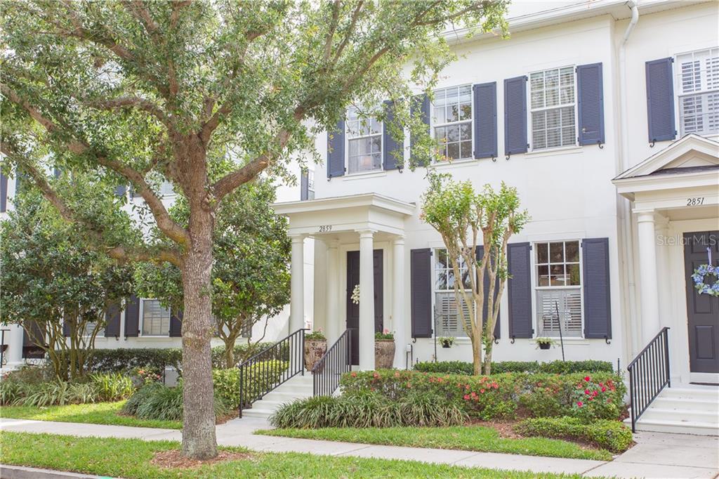2859 Upper Park Road Orlando, FL 32814 - Photo 1 of 1 front view of a white house with a yard