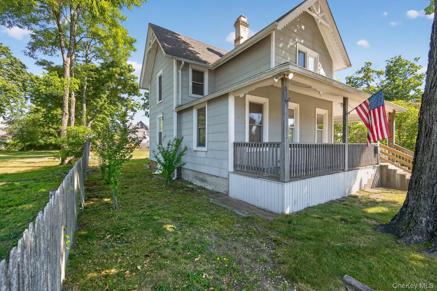 49 Cedar Street Babylon, NY 11702 - Photo 3 of 20 a view of a house with a yard