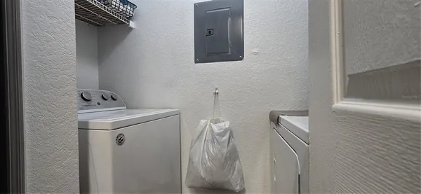 a bedroom with double bed and a window