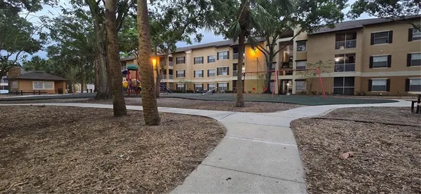 a view of a park with swings and slides