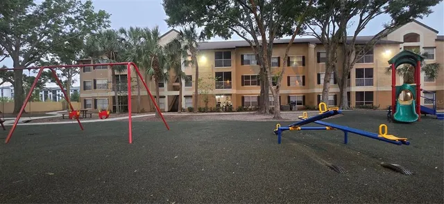 a view of a balcony with chairs and tables