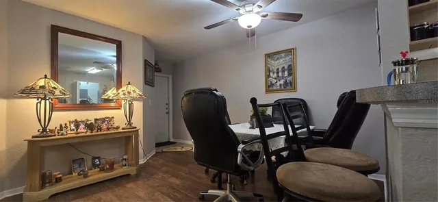 a view of a dining room with furniture and wooden floor