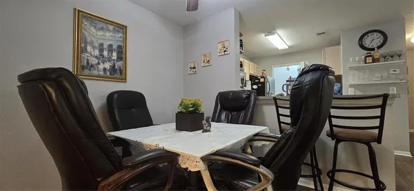 a kitchen with stainless steel appliances a refrigerator sink and microwave