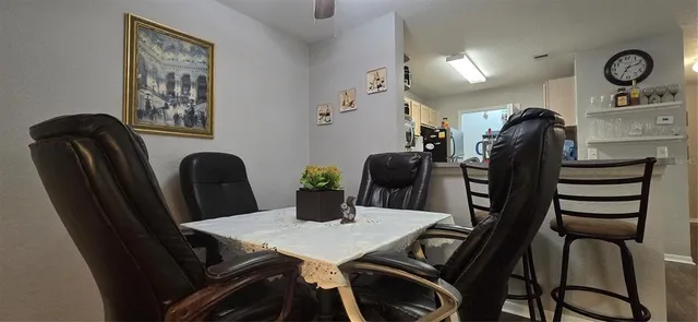 a kitchen with stainless steel appliances a refrigerator sink and microwave