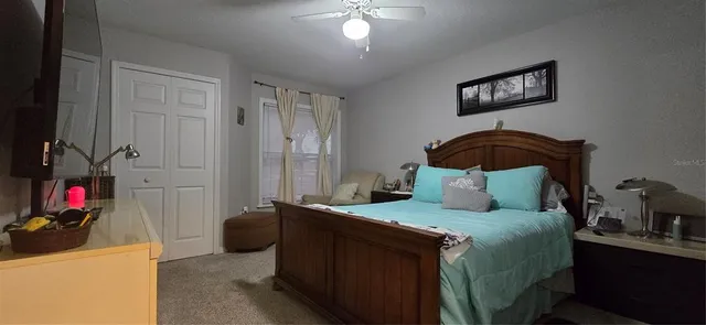 a bathroom with a sink vanity mirror and toilet
