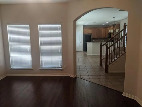 an entryway and livingroom with furniture