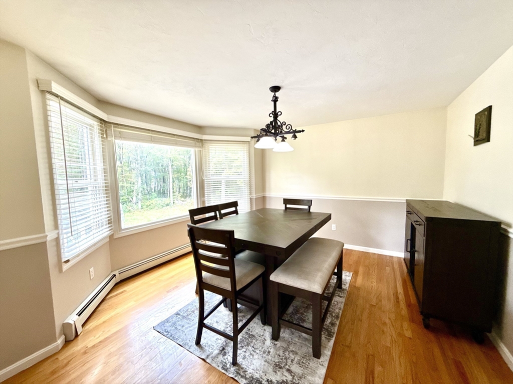 7 Tower Hill Road Oxford, MA 01540 - Photo 13 of 39 a view of a dining room with furniture and wooden floor