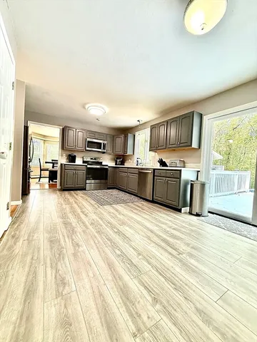 a large white bed in a white room