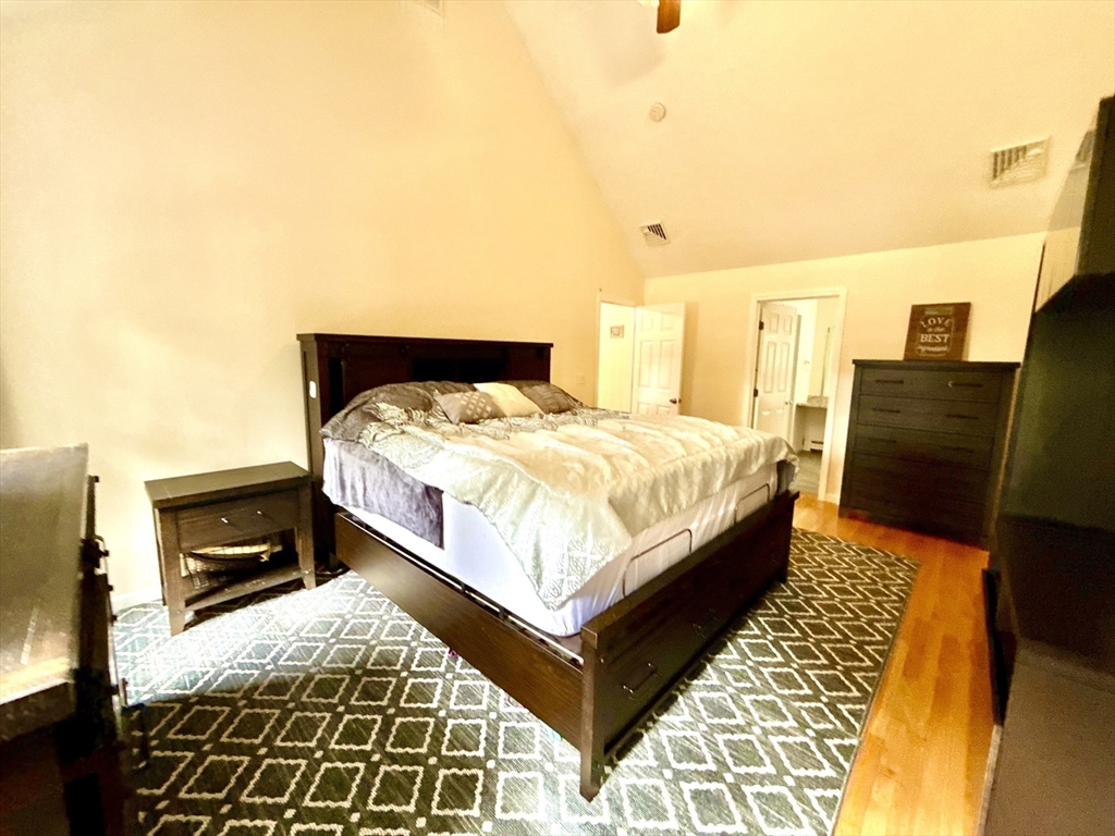 7 Tower Hill Road Oxford, MA 01540 - Photo 30 of 39 a bed sitting in a bedroom next to a couch