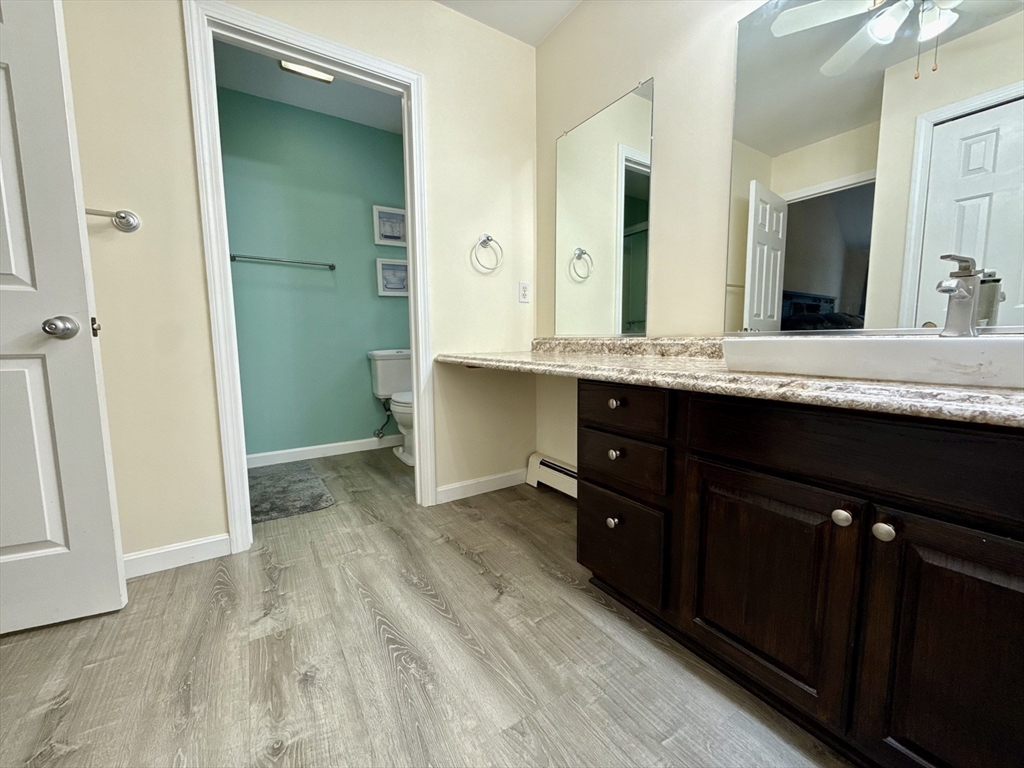 7 Tower Hill Road Oxford, MA 01540 - Photo 33 of 39 a spacious bathroom with a granite countertop sink and a mirror