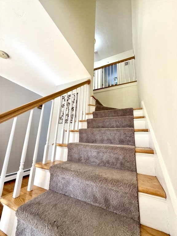 7 Tower Hill Road Oxford, MA 01540 - Photo 7 of 39 a view of staircase with white walls and a window