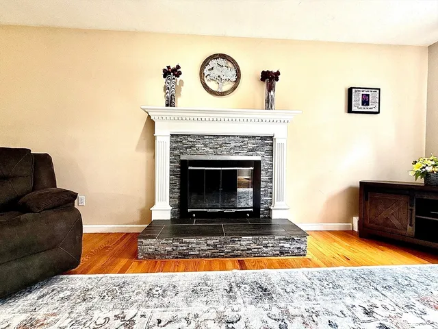 a living room with a couch and a fireplace