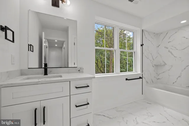 a bathroom with a sink and a bathtub