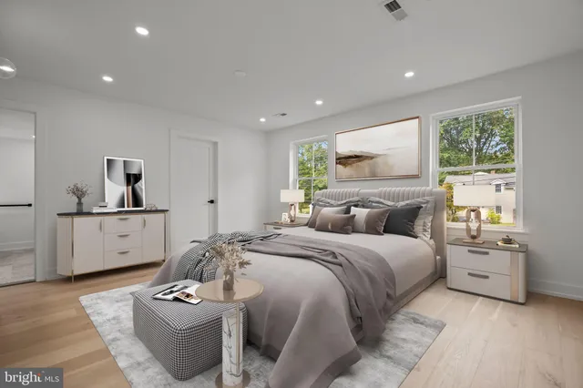 a bed room with bed and a window