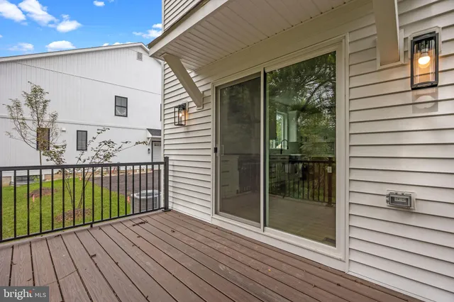 a view of a balcony with wooden floor