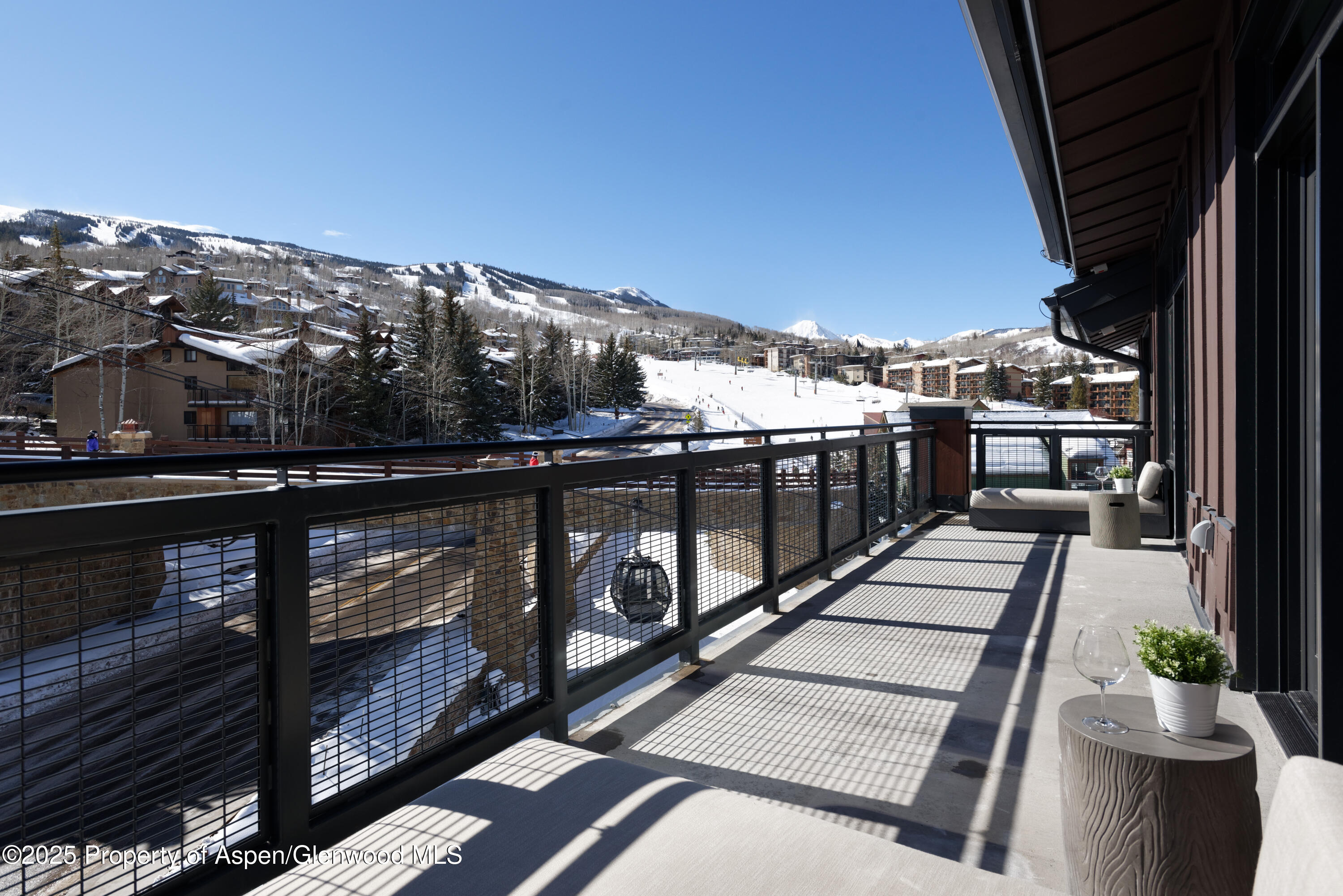 65 Wood Road, Unit 517 Snowmass Village, CO 81615 - Photo 20 of 28 a view of a balcony with wooden floor