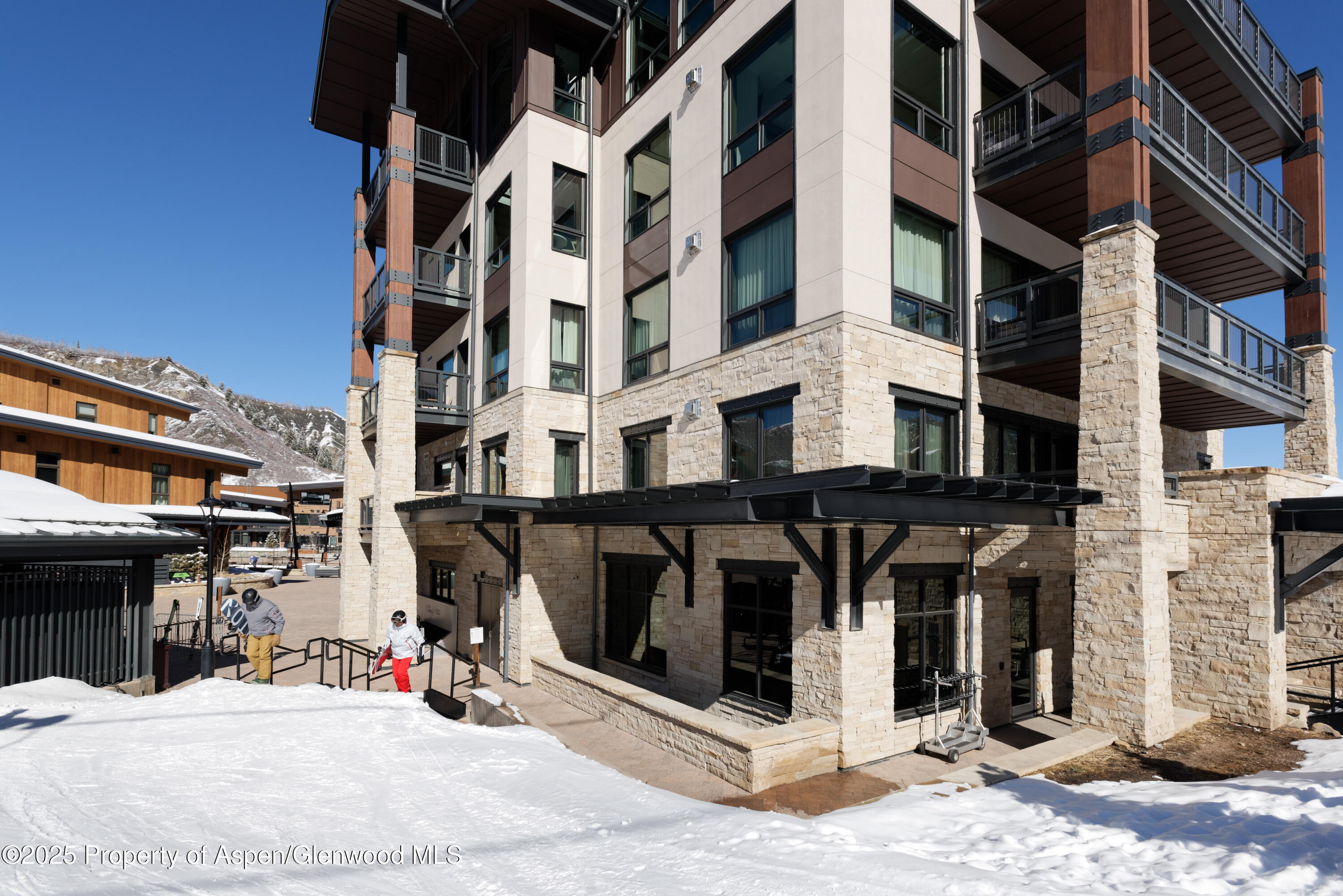 65 Wood Road, Unit 517 Snowmass Village, CO 81615 - Photo 23 of 28 a view of a building with a street