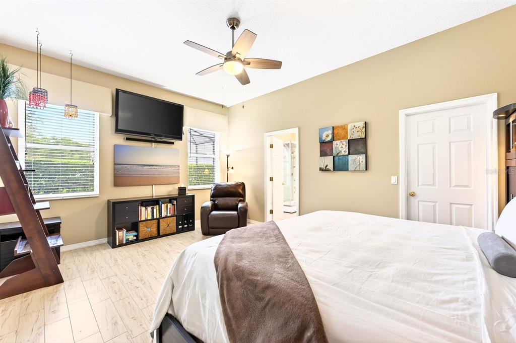 990 Ridgemount Place Lake Mary, FL 32746 - Photo 18 of 46 a bedroom with a bed and a flat screen tv