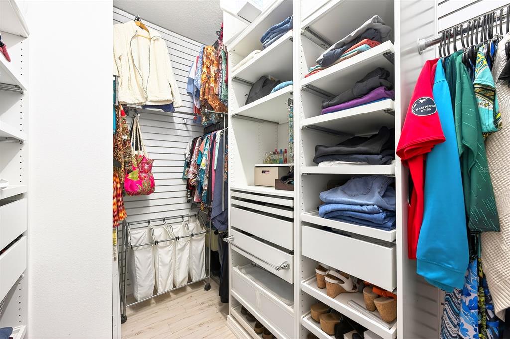 990 Ridgemount Place Lake Mary, FL 32746 - Photo 19 of 46 a view of walk in closet with clothes and shoes