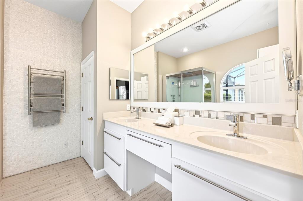 990 Ridgemount Place Lake Mary, FL 32746 - Photo 20 of 46 a bathroom with a sink double vanity and a mirror