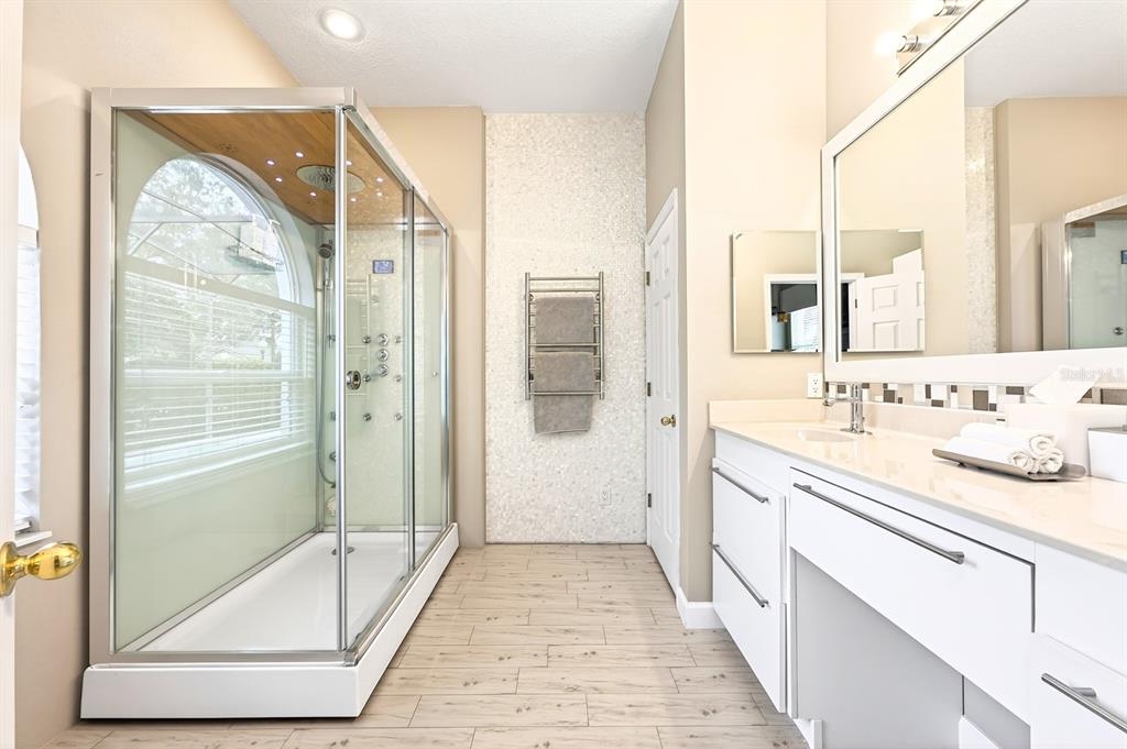 990 Ridgemount Place Lake Mary, FL 32746 - Photo 21 of 46 a bathroom with a granite countertop sink mirror and a