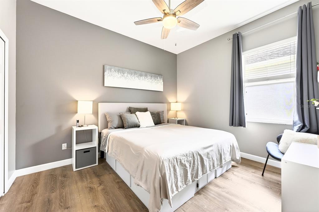 990 Ridgemount Place Lake Mary, FL 32746 - Photo 24 of 46 a bedroom with a bed and a chandelier