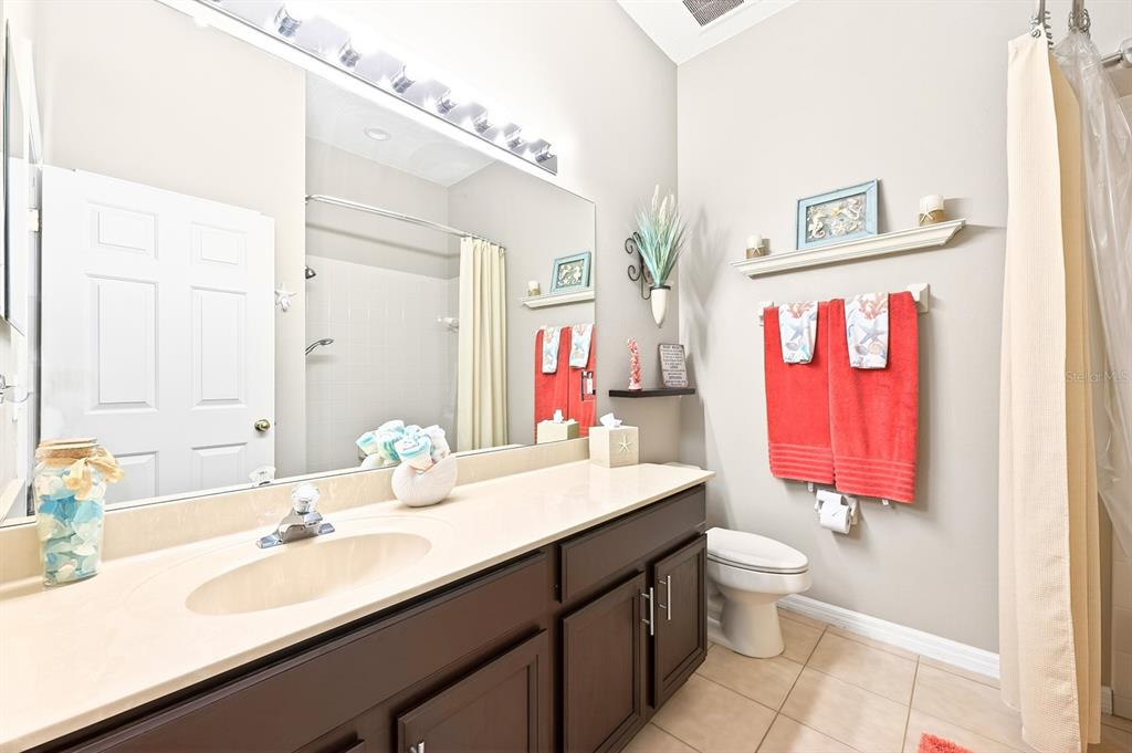 990 Ridgemount Place Lake Mary, FL 32746 - Photo 25 of 46 a bathroom with a sink and a mirror