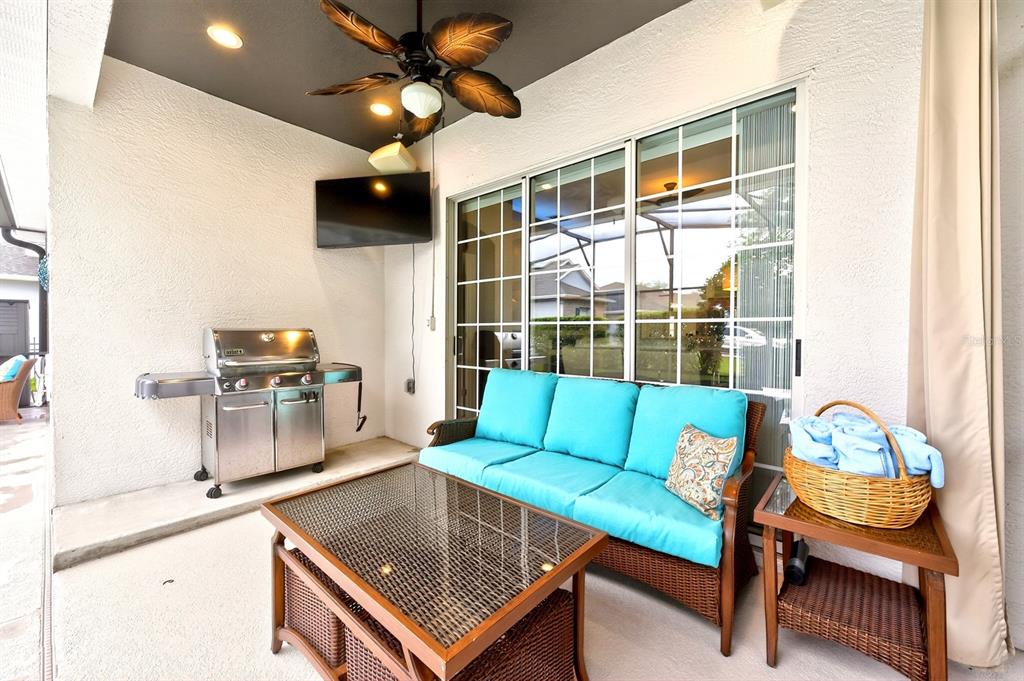 990 Ridgemount Place Lake Mary, FL 32746 - Photo 29 of 46 a living room with furniture and a flat screen tv