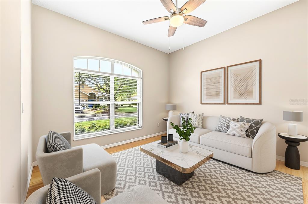 990 Ridgemount Place Lake Mary, FL 32746 - Photo 5 of 46 a living room with furniture and a large window