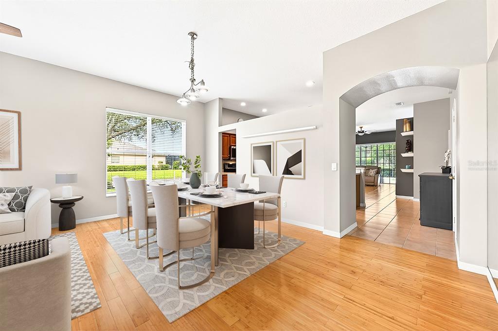 990 Ridgemount Place Lake Mary, FL 32746 - Photo 7 of 46 a view of a dining room with furniture window and wooden floor