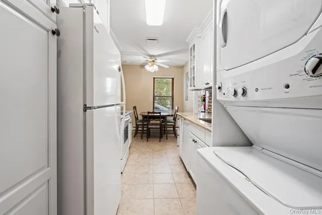 a dining room with furniture and a chandelier