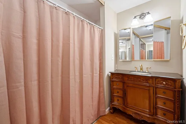 a bathroom with a double vanity sink and mirror