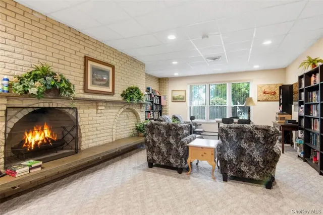 a room with pool table and windows