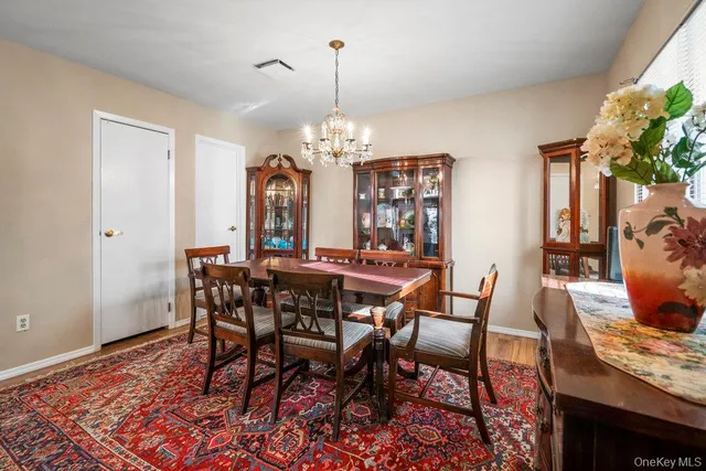 a view of a dining room with furniture and window