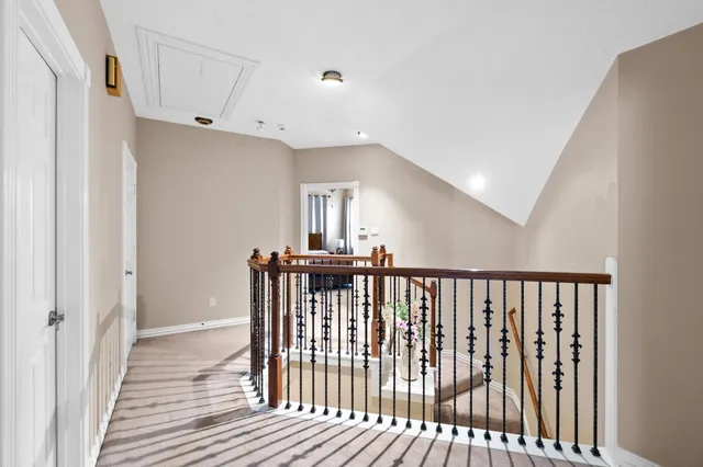a view of hallway with wooden floor