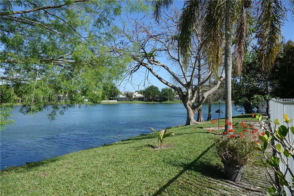 2120 Northwest Marsh Rabbit Lane Jensen Beach, FL 34957 - Photo 7 of 34 a backyard of a house with lots of green space