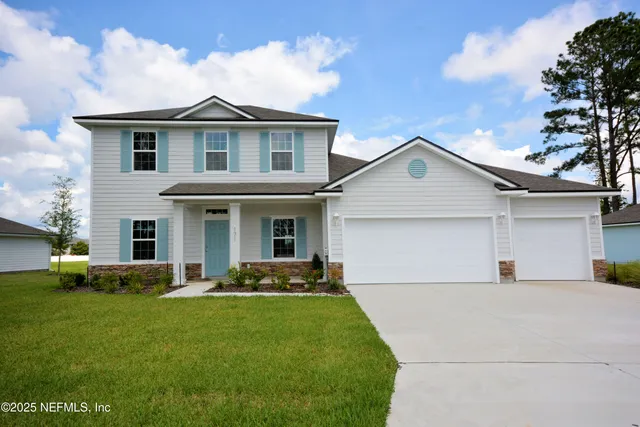 front view of a house with a yard