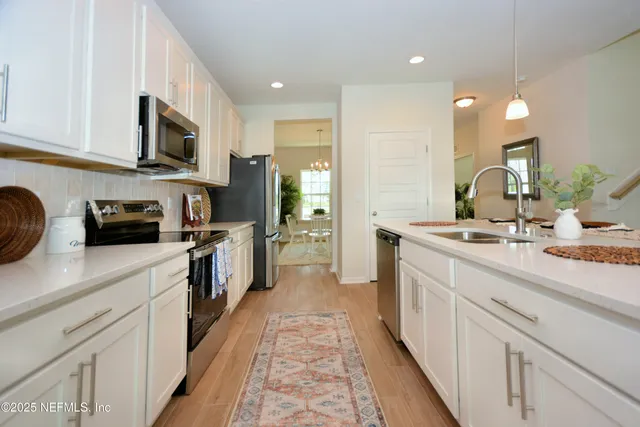 a large kitchen with cabinets