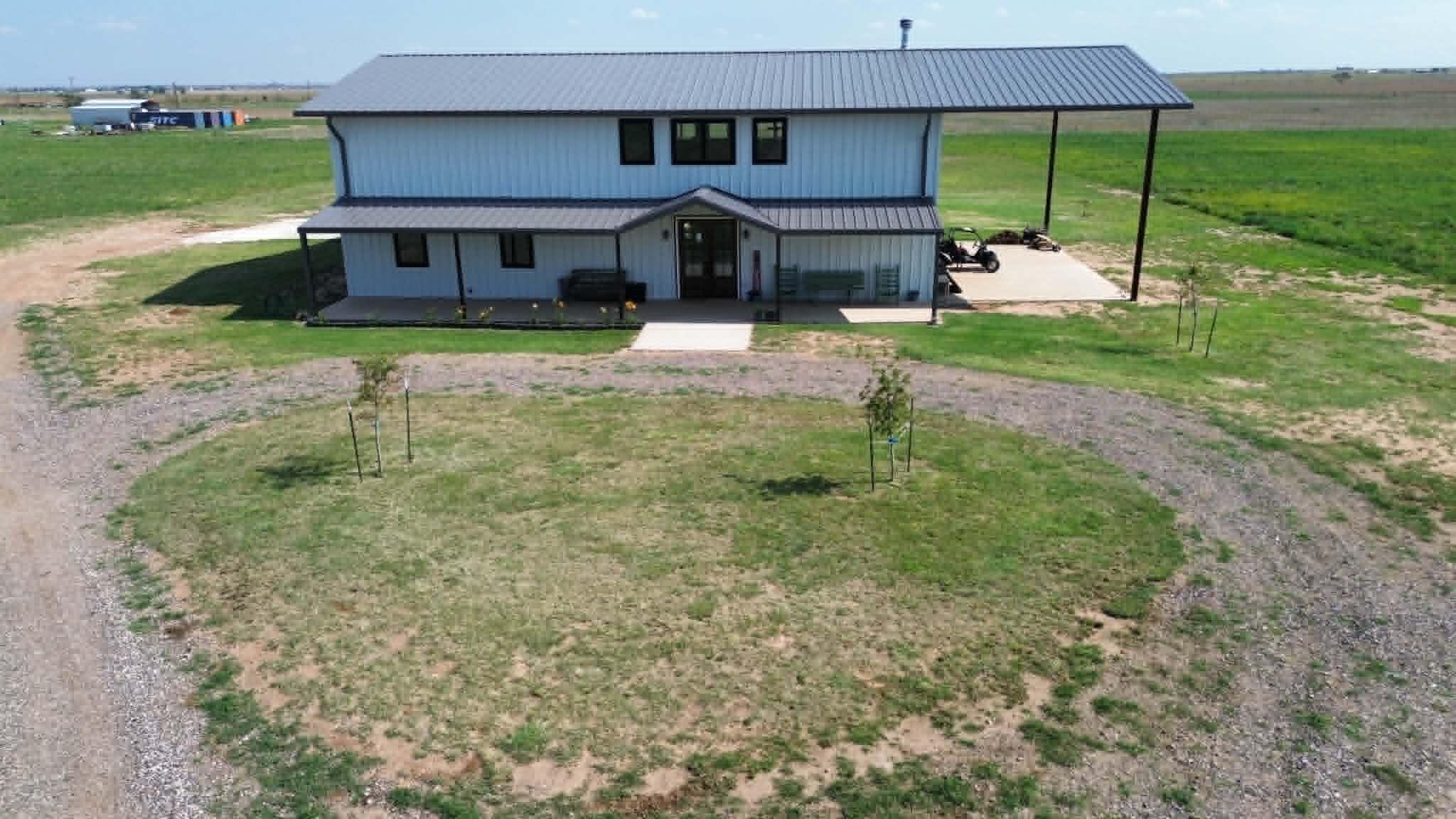 6792 Maine Road Anton, TX 79313 - Photo 2 of 77 a view of a house with backyard porch and sitting area