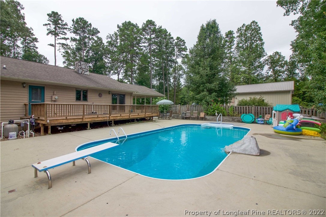 144 Manor Road Carthage, NC 28327 - Photo 19 of 47 a view of a swimming pool with lounge chair
