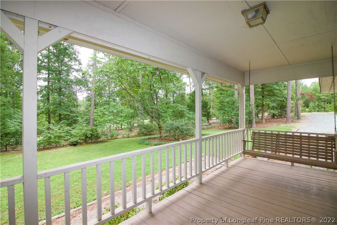 144 Manor Road Carthage, NC 28327 - Photo 2 of 47 a view of porch with a floor to ceiling window and wooden floor