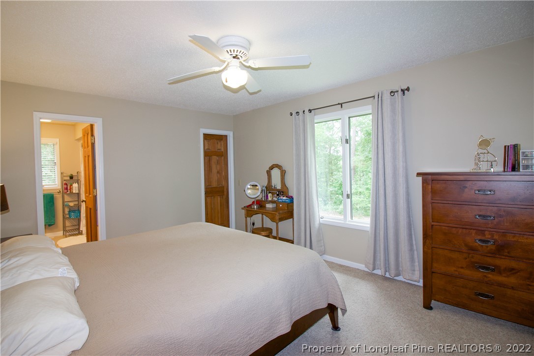 144 Manor Road Carthage, NC 28327 - Photo 23 of 47 a bedroom with a bed and a dresser
