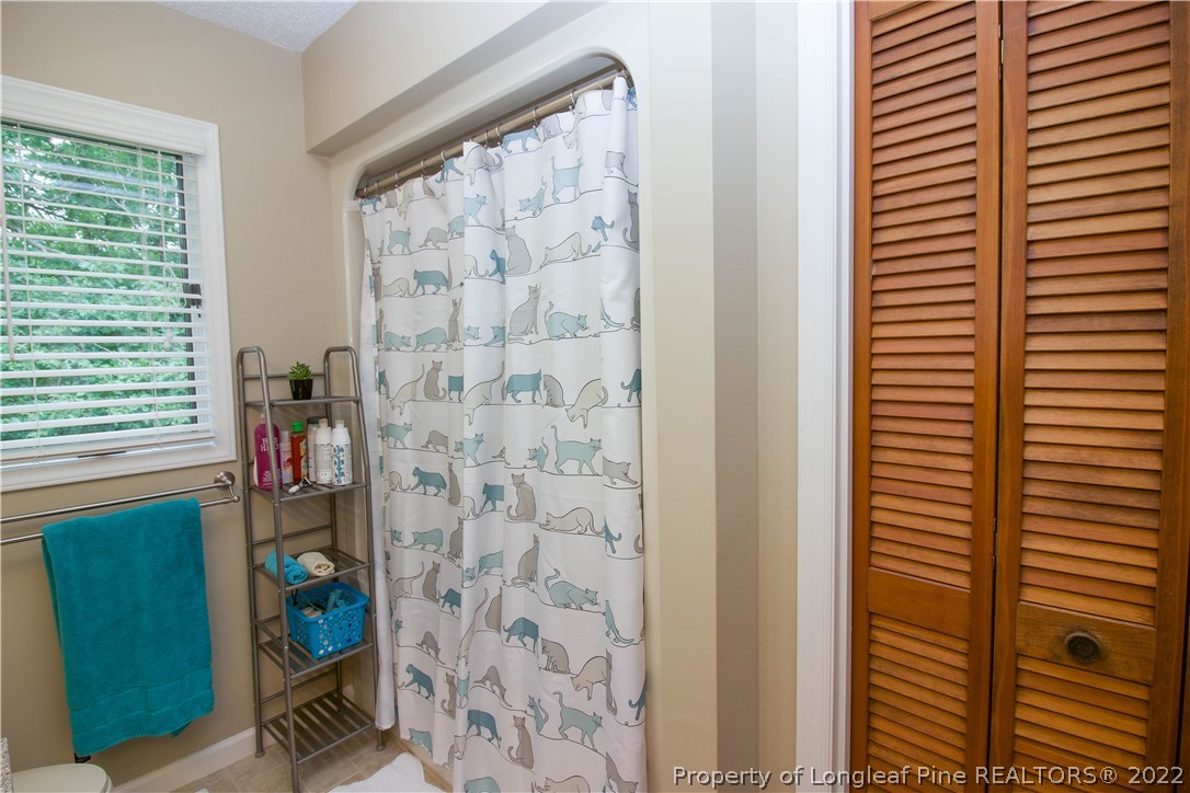 144 Manor Road Carthage, NC 28327 - Photo 24 of 47 a bathroom with a shower and a window