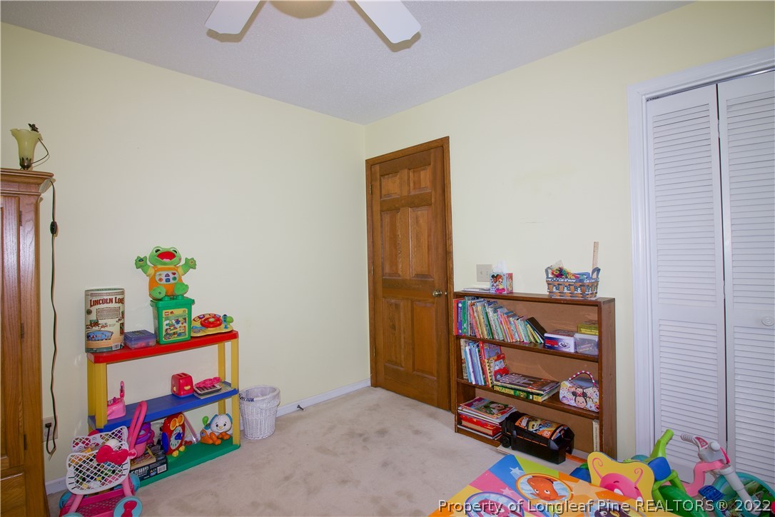144 Manor Road Carthage, NC 28327 - Photo 33 of 47 a children room with toys and a book shelf