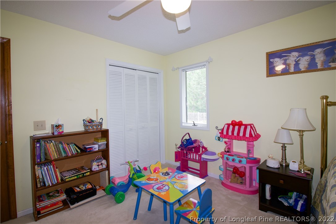 144 Manor Road Carthage, NC 28327 - Photo 34 of 47 a bedroom with furniture and a wooden floor