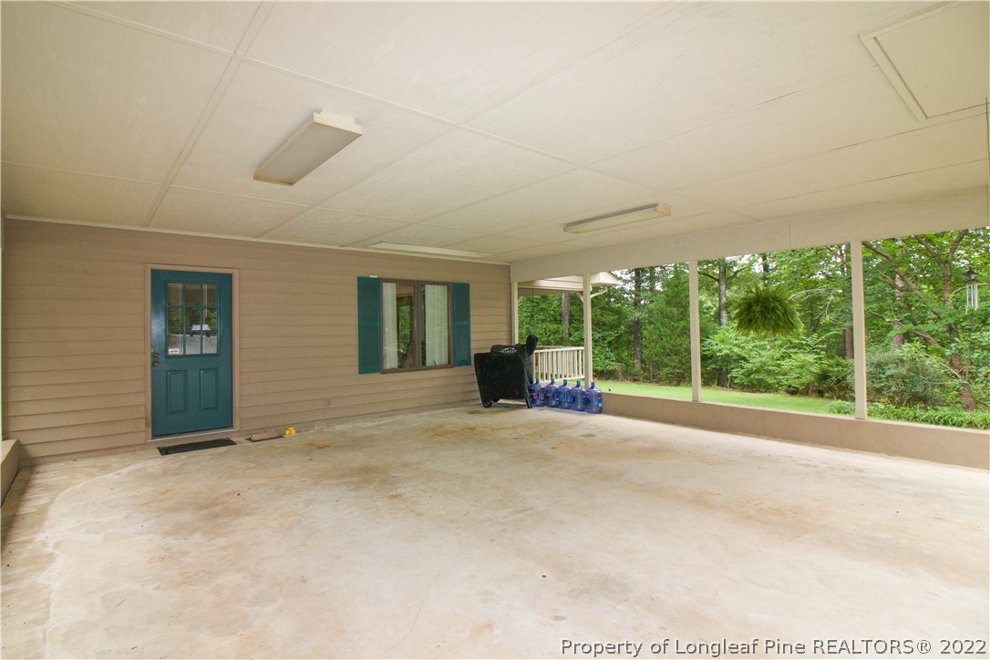 144 Manor Road Carthage, NC 28327 - Photo 5 of 47 a view of an empty room with windows and balcony