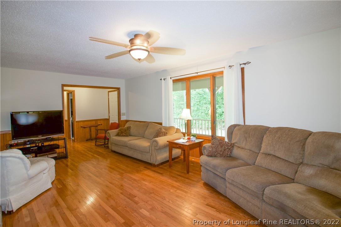 144 Manor Road Carthage, NC 28327 - Photo 7 of 47 a living room with furniture and a flat screen tv