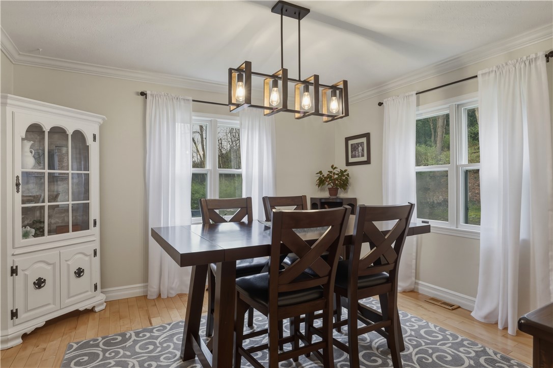2304 Whiskey Creek Road Corning, NY 14830 - Photo 7 of 42 Dining Room featuring a built-in hutch, and hardwood flooring.