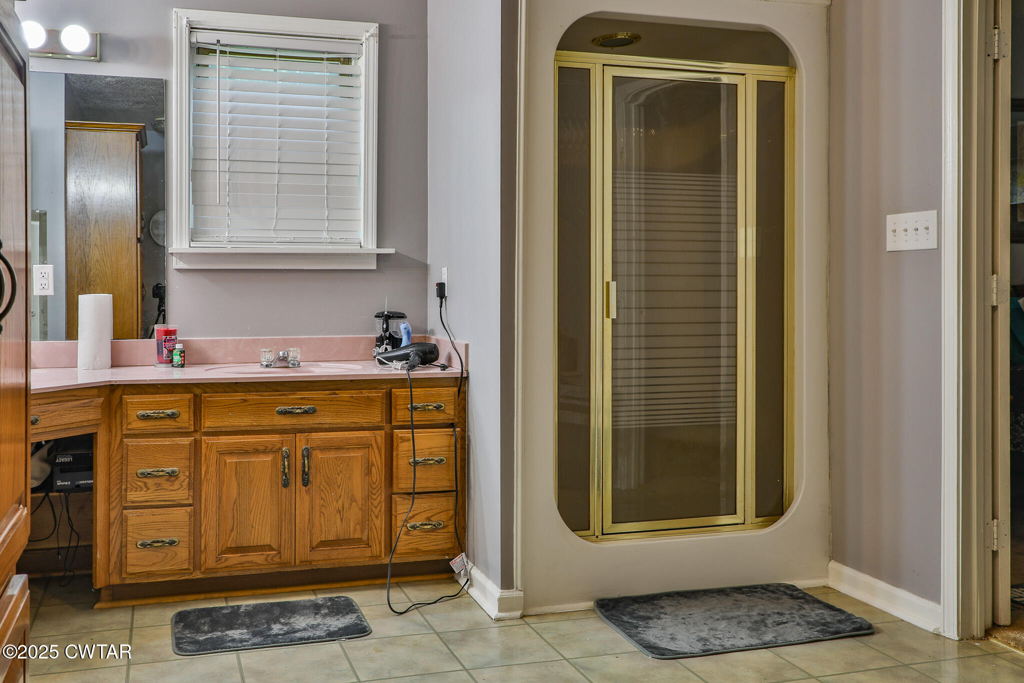18 Tollie Markham Road Dyer, TN 38330 - Photo 12 of 27 a bathroom with a sink a mirror and shower