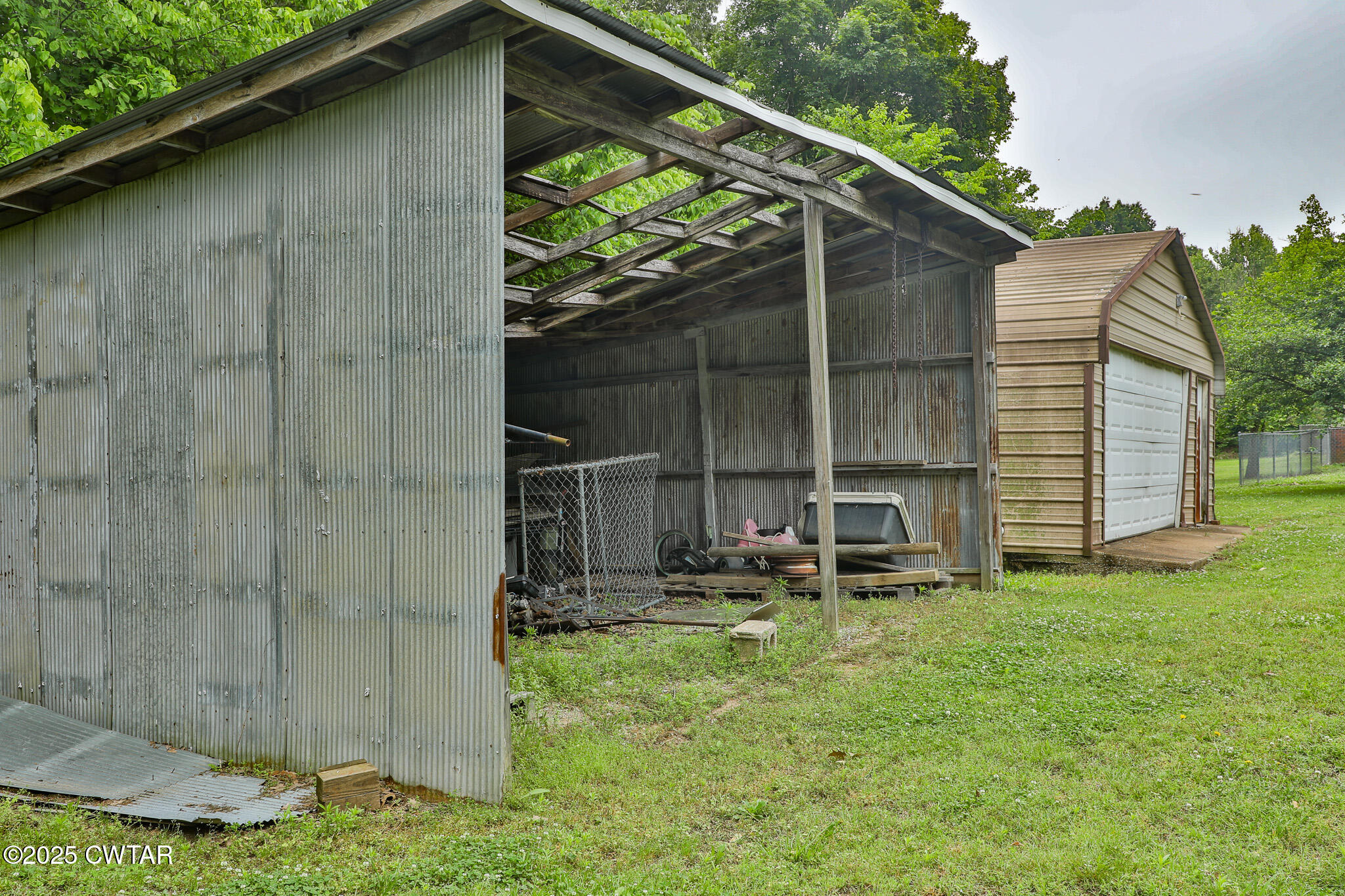 18 Tollie Markham Road Dyer, TN 38330 - Photo 22 of 27 a backyard of a house with table and chairs